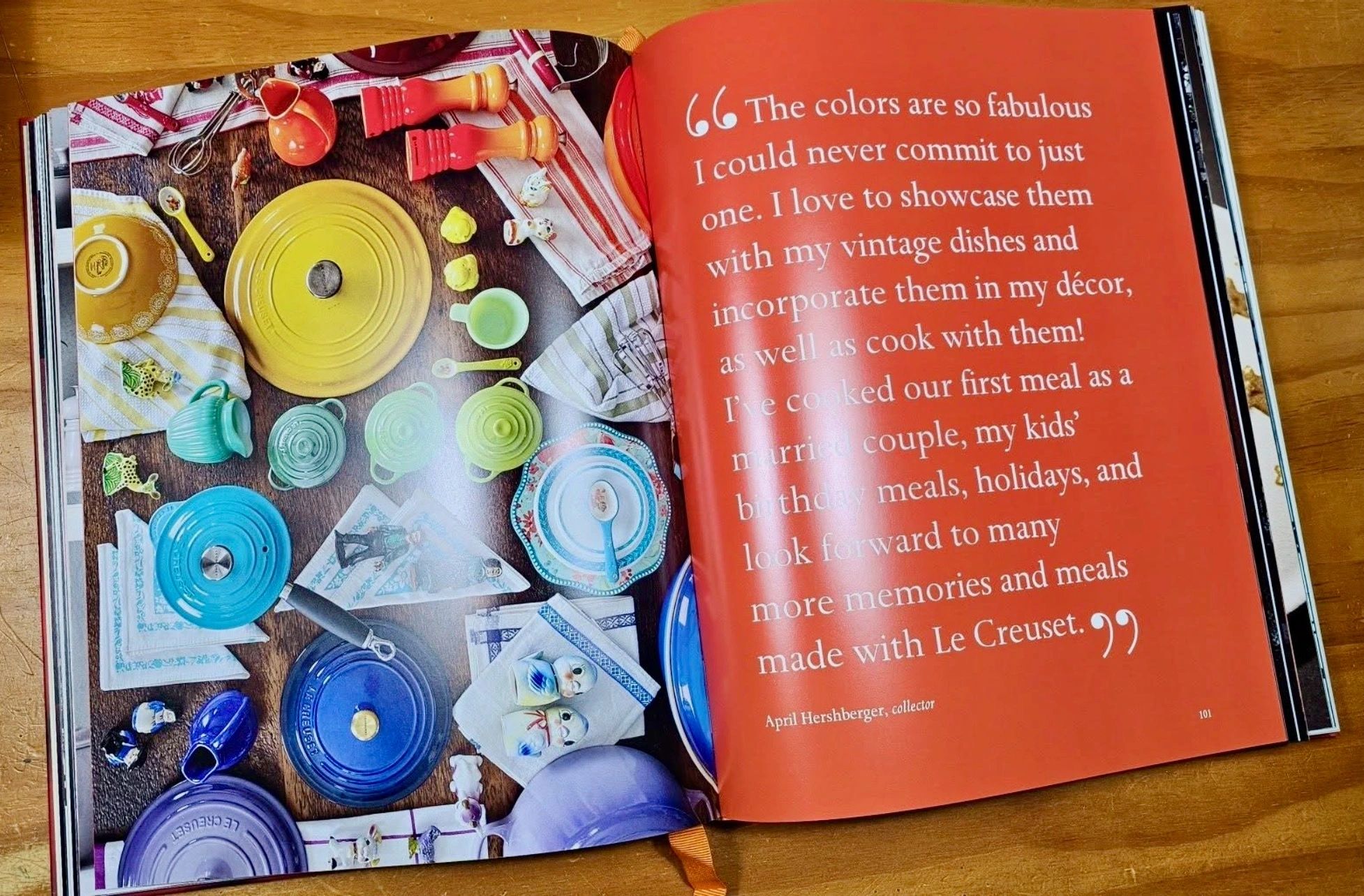 Le Creuset 100th anniversary commemorative book open to a flat-lay photo page