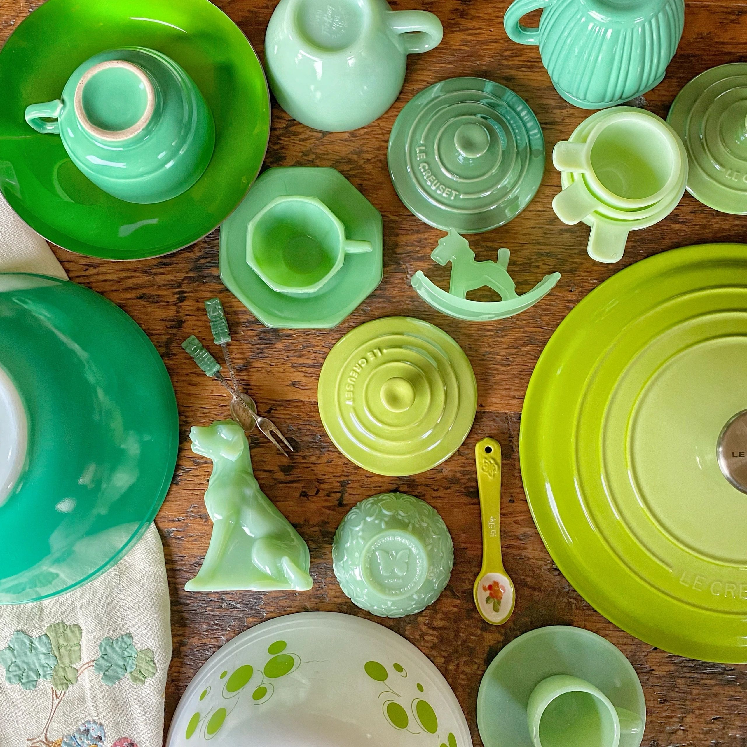 Green ceramics and glass collection flat lay